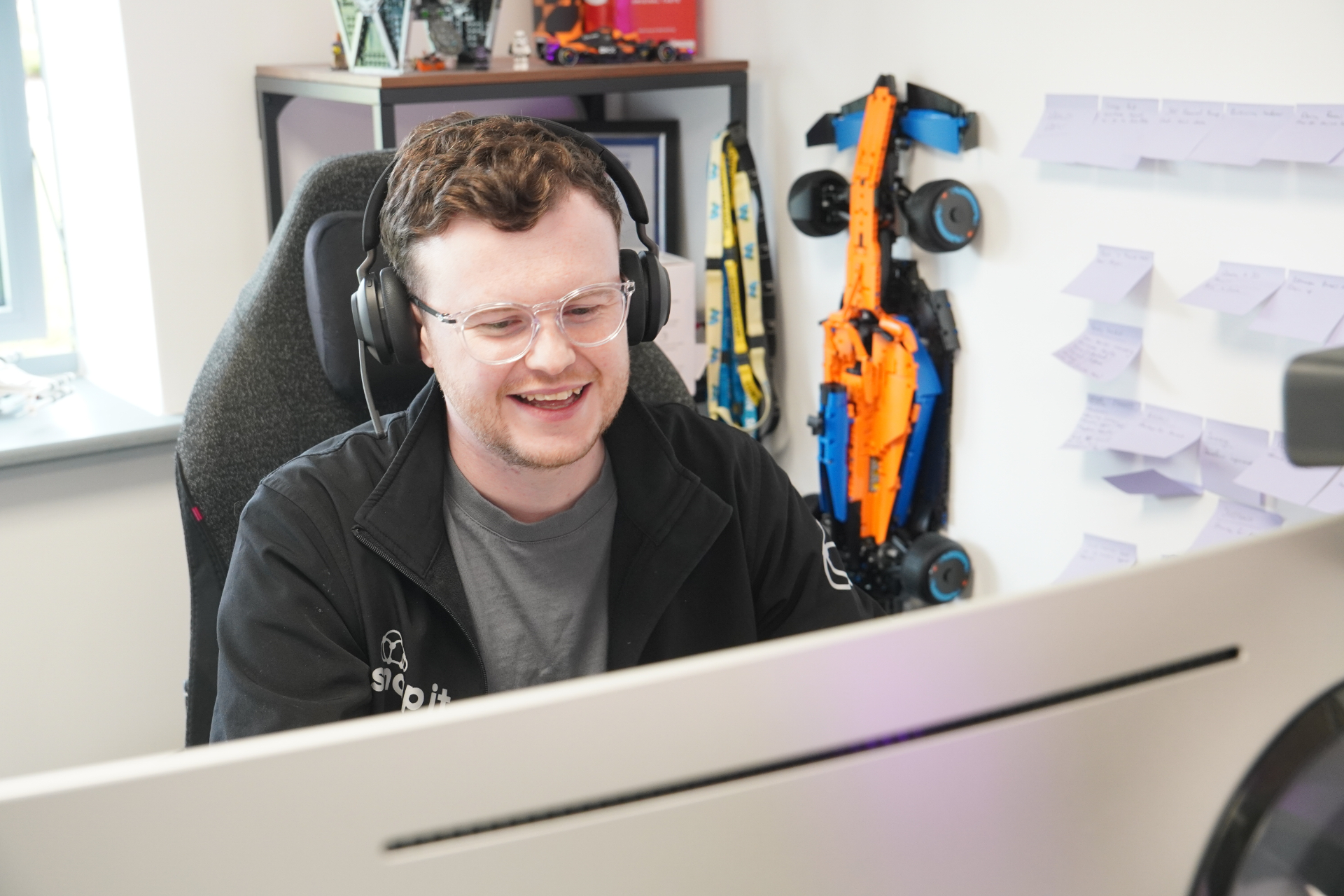 A Snap IT engineer on a video call from the office